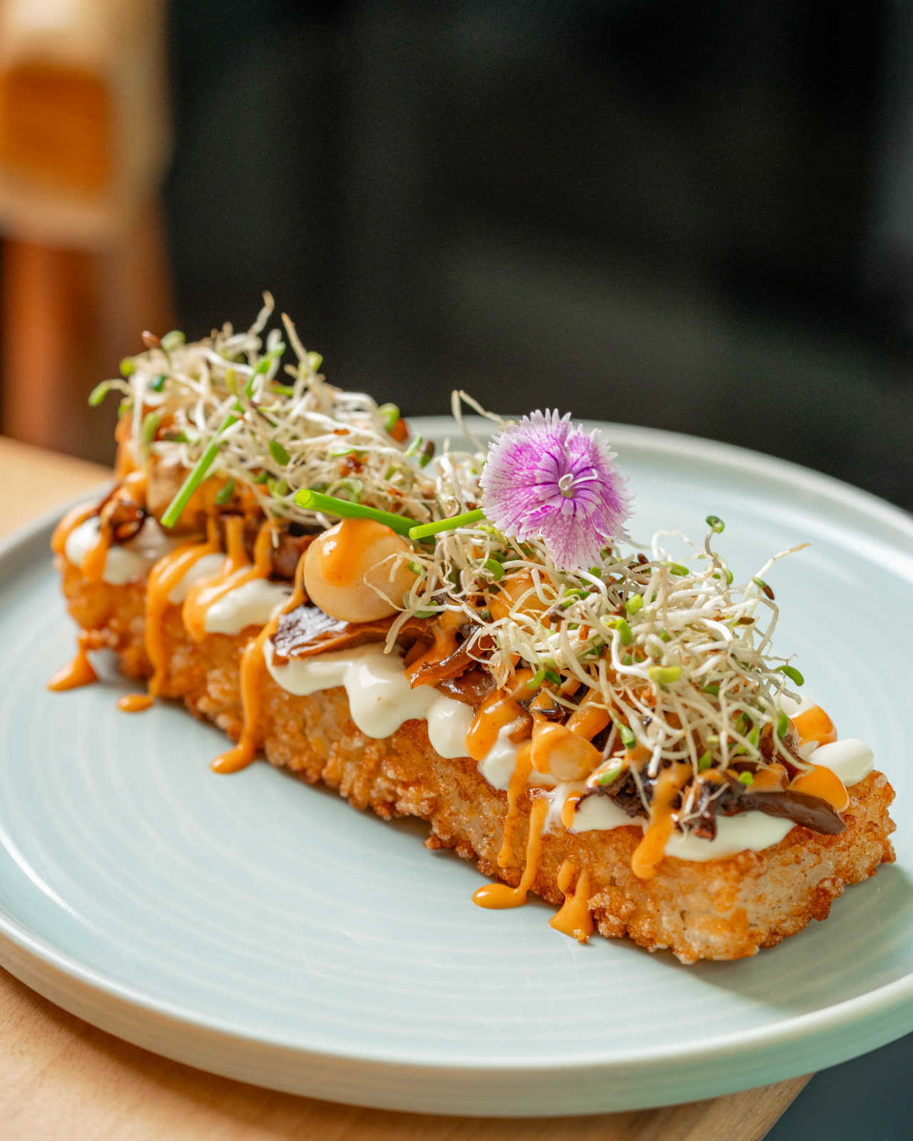 Crispy rice with spicy salmon and sprouts