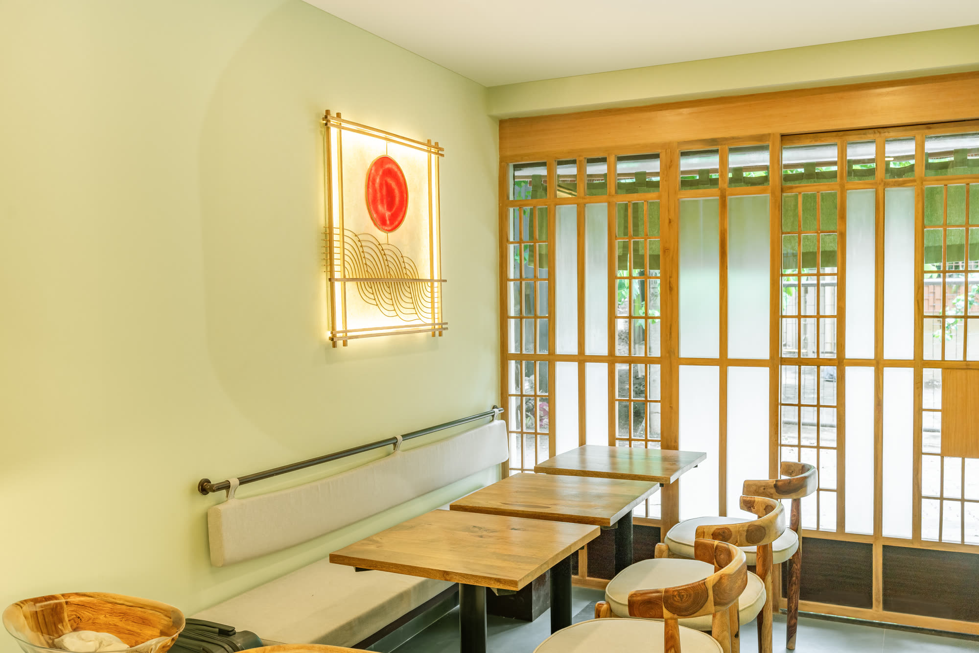 The Abokado dining room, with its lit sun-and-wave panel